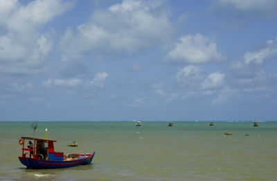 Boat in sea against sky