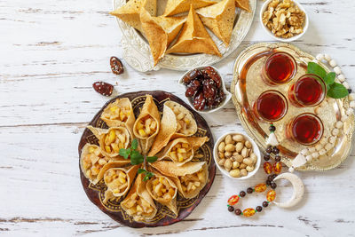 Ramadan menu assorted arabian pancake katayef and dates, pistachio. 