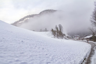 Scenic view of snow covered mountains against sky