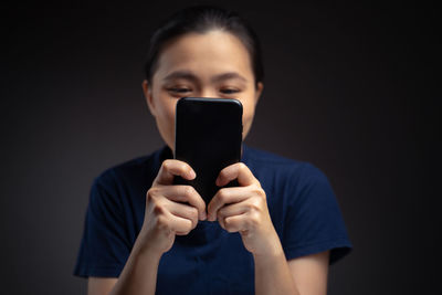 Portrait of man using mobile phone