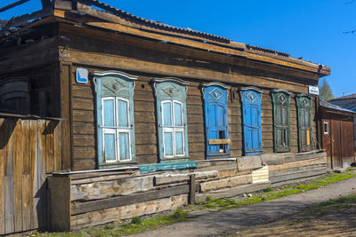 Low angle view of old building against blue sky