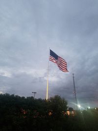 Low angle view of flag against sky