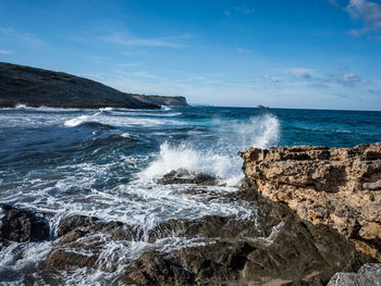 Scenic view of sea against blue sky