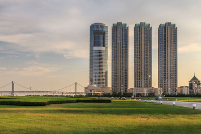 Modern buildings in city against sky