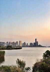 Scenic view of sea against clear sky during sunset