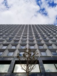 Low angle view of office building against sky