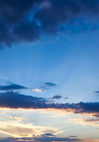 Low angle view of clouds in sky during sunset