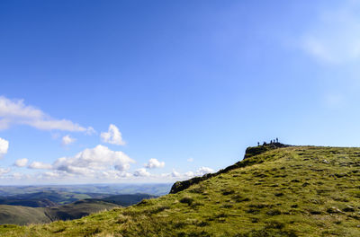 Scenic view of cadair idris against blue sky at snowdonia national park