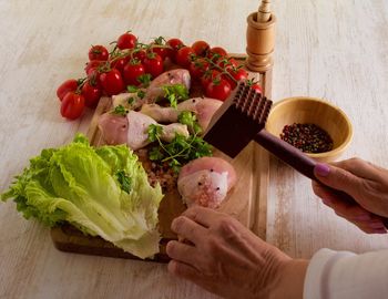 Cropped image of woman hand preparing food in kitchen
