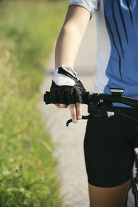 Midsection of man riding bicycle