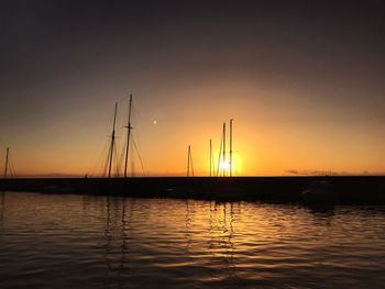 Silhouette of marina at sunset