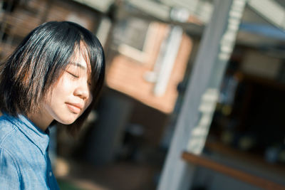 Close-up of young woman with black hair