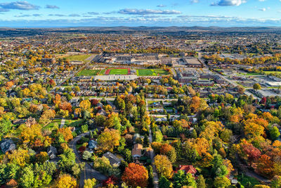 High angle view of plants in city against sky