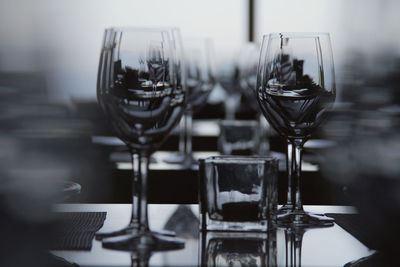 Close-up of wineglasses on table