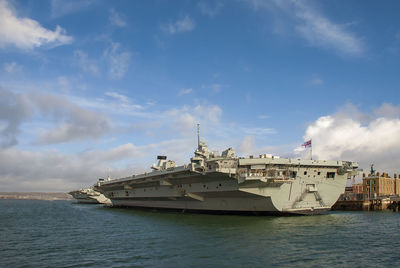 View of ship in sea against cloudy sky