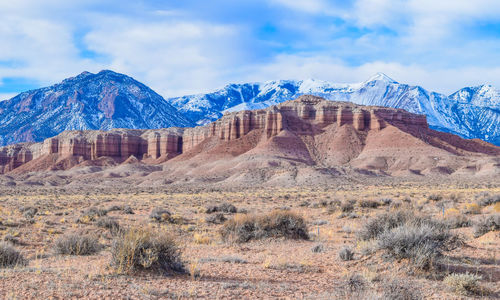 View of rocky mountains against cloudy sky