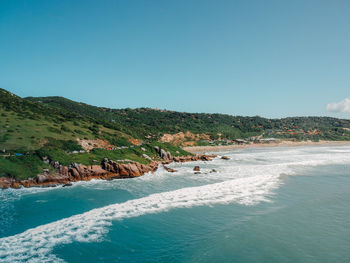 Scenic view of sea against clear blue sky