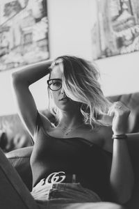 Portrait of young woman sitting outdoors