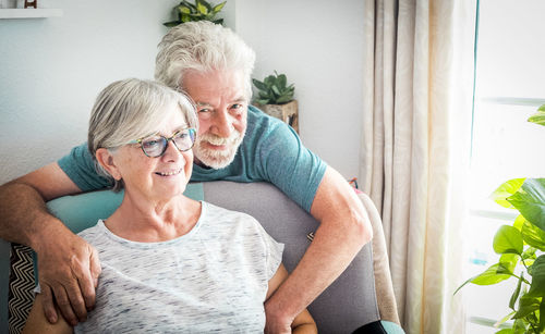 Smiling senior couple at home