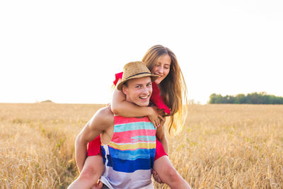 Portrait of smiling girl on field