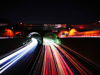 Light trails on road in city at night