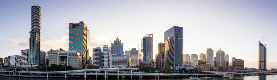 Modern buildings in city against clear sky