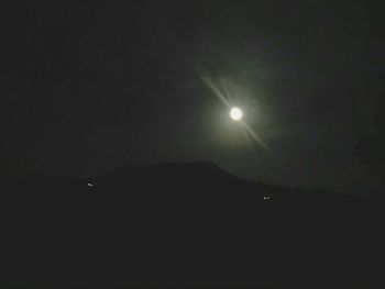 Low angle view of moon against sky at night