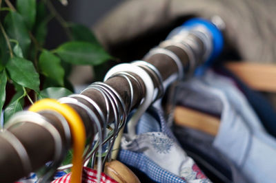 Close-up of hangers and cloth at home