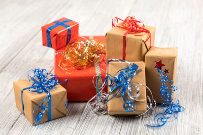 Close-up of christmas presents on wooden table