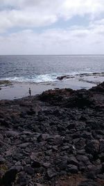 Scenic view of sea against cloudy sky