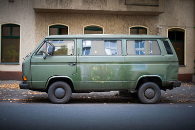 Vintage car on street against building