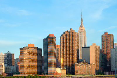 Modern buildings in city against sky