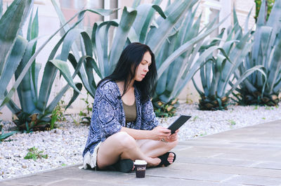 Young woman using mobile phone