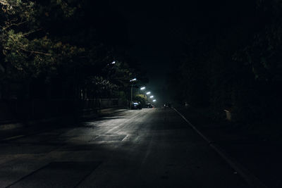 Illuminated road at night