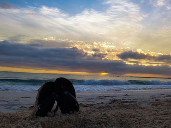 Scenic view of beach against sky during sunset