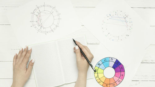 Cropped hand writing in book