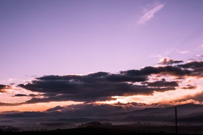 Silhouette landscape against sky during sunset