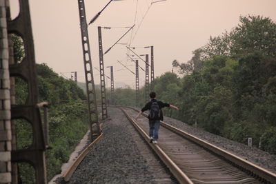 People walking on railroad track