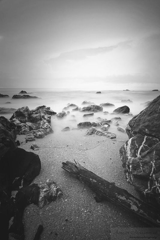 sea, horizon over water, beach, water, shore, sky, tranquil scene, tranquility, scenics, beauty in nature, nature, sand, rock - object, coastline, idyllic, sunset, cloud - sky, wave, calm, outdoors