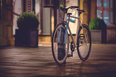 Bicycle on street against building