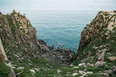 High angle view of rocks by sea