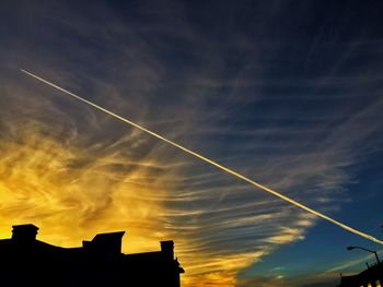 Low angle view of vapor trails in sky