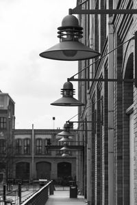 Street light against sky in city