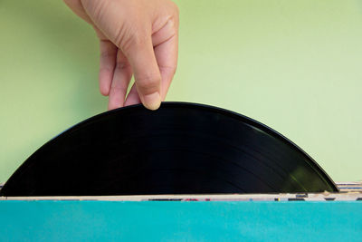 Close-up of hand holding record