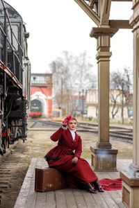 Rear view of woman standing in city