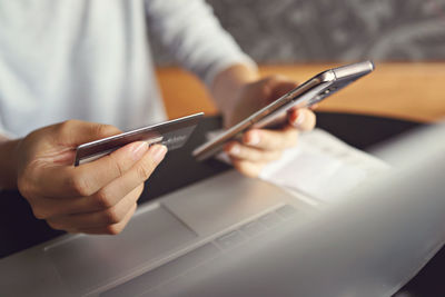 Close-up of man using mobile phone