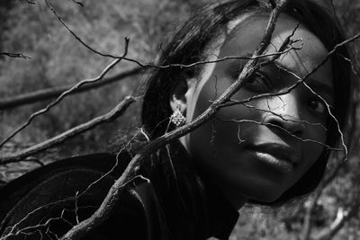 Close-up portrait of woman looking away outdoors