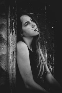 Portrait of beautiful young woman looking away