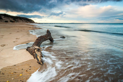 Scenic view of sea against cloudy sky