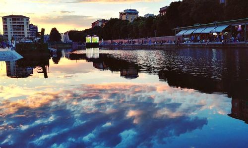 Scenic view of river against cloudy sky